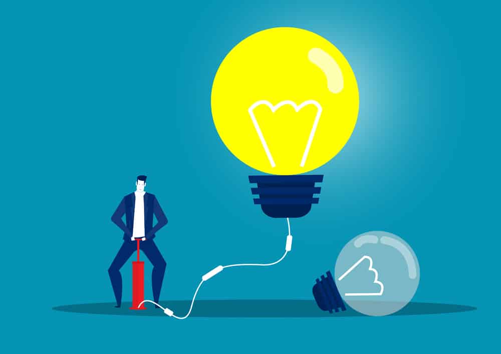 Illustration d'homme d'affaires soufflant ampoule par pompe à air