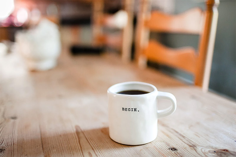 begin the day with a cup of coffee