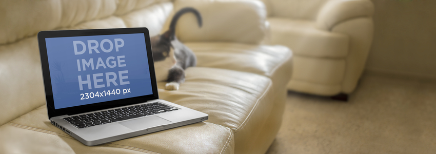 نموذج بالحجم الطبيعي لجهاز Macbook Pro على White Leather Couch Placeit Image