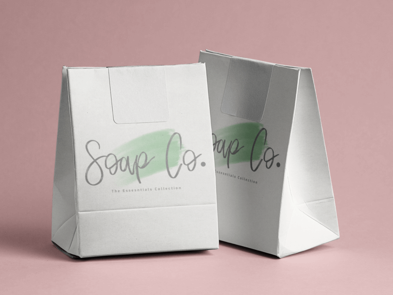 Maquete de saco de papel com dois sacos de papel sobre uma superfície plana