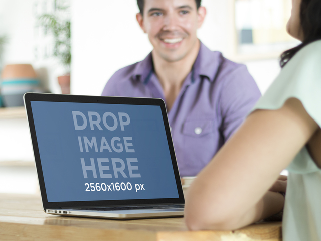 Maquete do Macbook Pro com uma imagem criativa do cenário de escritório Placeit Stage