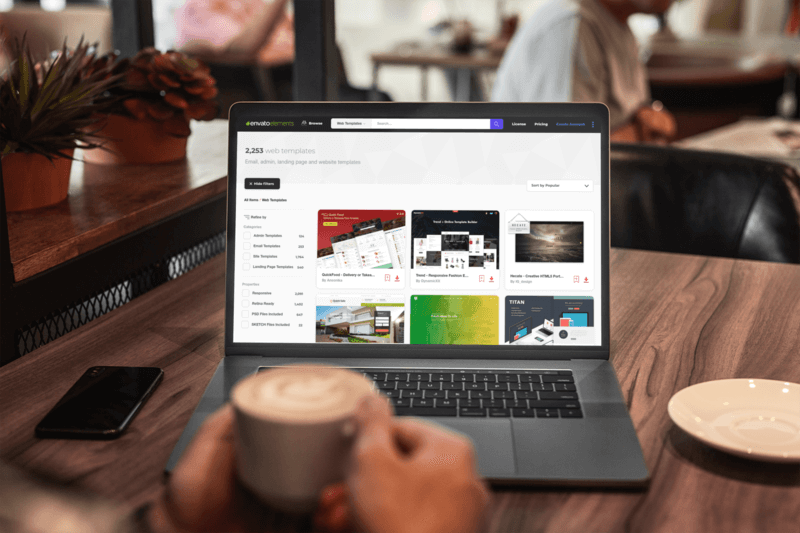 Macbook Pro Mockup mit einem Mann, der in einem Café arbeitet